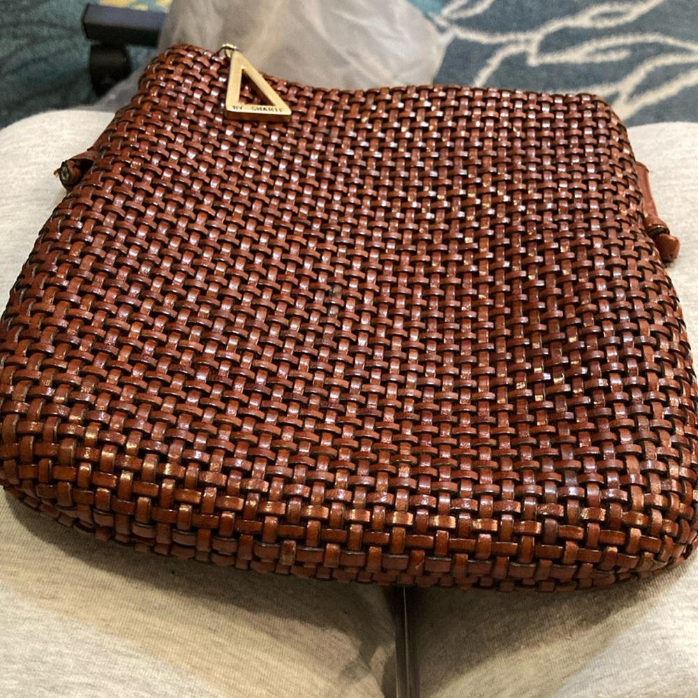 Sharif Americana purse rust color. In good condition